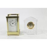 A brass cased 8 day English carriage clock, bevel edged glass panels, movement stamped 'Made In