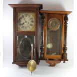 A mahogany cased Vienna style wall clock, having 8 day movement striking to gong, 62cm long,