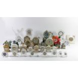 A collection of cut-glass/crystal mantle and bedside clocks, makers to include - Waterford,