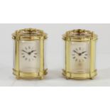 A pair of English miniature carriage clocks, brass cased with bevel edged glass panels, enamelled