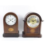 A mahogany cased mantel clock, 8 day movement, striking the hour and half hours, enamel dial with