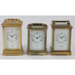 Three brass cased manual wind carriage clocks, enamelled dials bearing the names - A.Pattorini