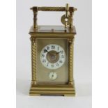 A gilt brass repeating, half and full hour striking, alarm carriage clock, brass dial with ivorine