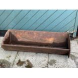 A cast iron trough, 91cm x 23cm x 34cm