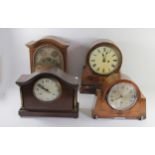 Three early 20th Century oak cased chiming mantel clocks, together with an Edwardian mahogany inlaid