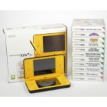 A Nintendo DSi XL, original box, charger, stylus, guides and manuals (missing large stylus),