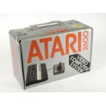 An Atari 2600 (serial No X7233405324), original box, AV and power cables, Atari joystick, manual and