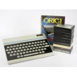 An Oric-1 48k computer, together with Oric-1 Basic Programming Manual, AV and power cables, also