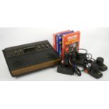 An Atari 2600 (serial No. 817414), power cable, two paddle controllers, an Atari joystick and a