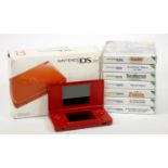 A Nintendo DS Lite console, red, with charger, stylus, manuals and original box, together with Brain