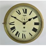 A Smith Astral bulk head clock, brass case, hinged door (no glass), painted dial with seconds