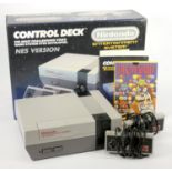 A Nintendo NES, console, two joypads, AV and power cables, with manuals, original box and