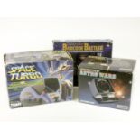 Three electronic tabletop games, boxed, to include Grandstand Astro Wars (manual), Tomy Space