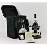 A Bresser Biolux NV microscope, carry case, power cable, lens, tools, accessories, slides and