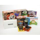 A Tomy Super Cup Football table top game, together with six hand held electronic games, to include