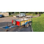 A twin axle trailer, gross laden weight stated 2000KG, with ladder rack and metal sides/floor,