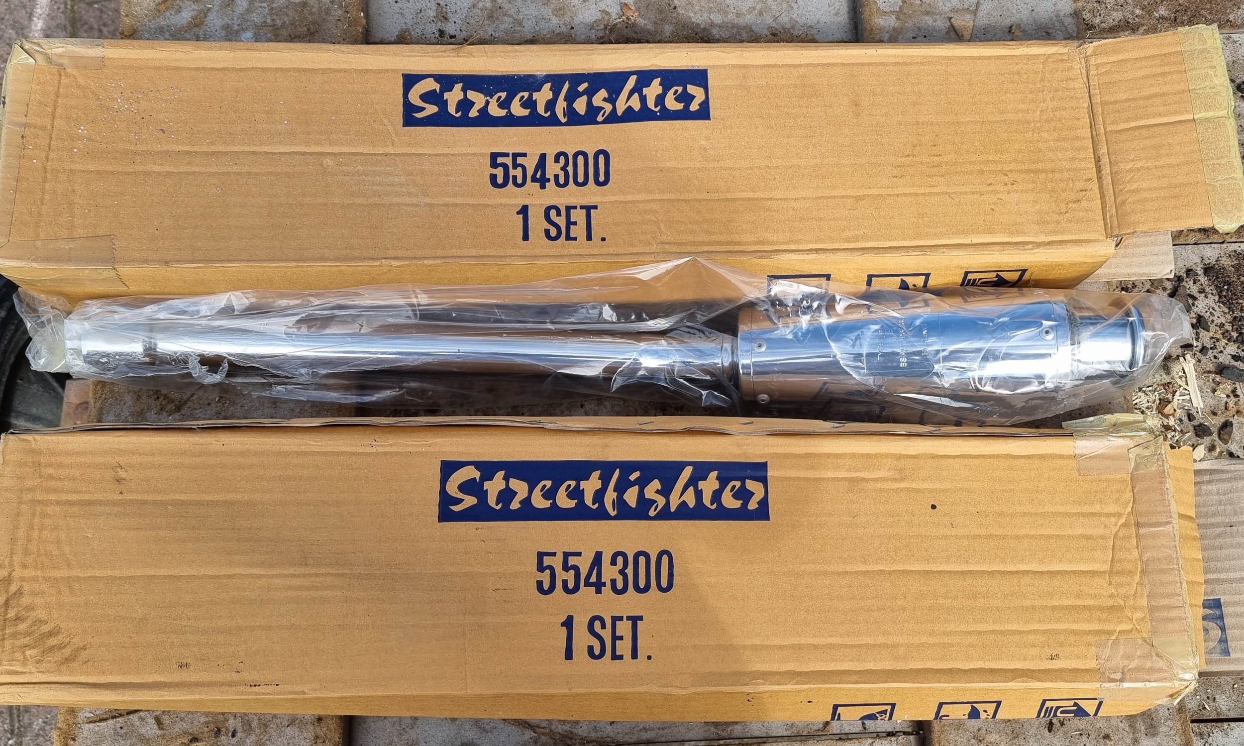 A pair of new old stock Streetfighter 554300 exhaust pipes