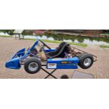 A children's kart, 60cc, age 6-10, with Comer S60 pull start engine, wet and dry tyres, spare