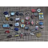 A collection of 35 enamel marque and other badges, including TriBSA, Norton, MV Agusta, c.1960/70's