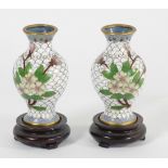 A Japanese pair of cloisonne baluster vases, decorated with a floral spay, 8cm, together with