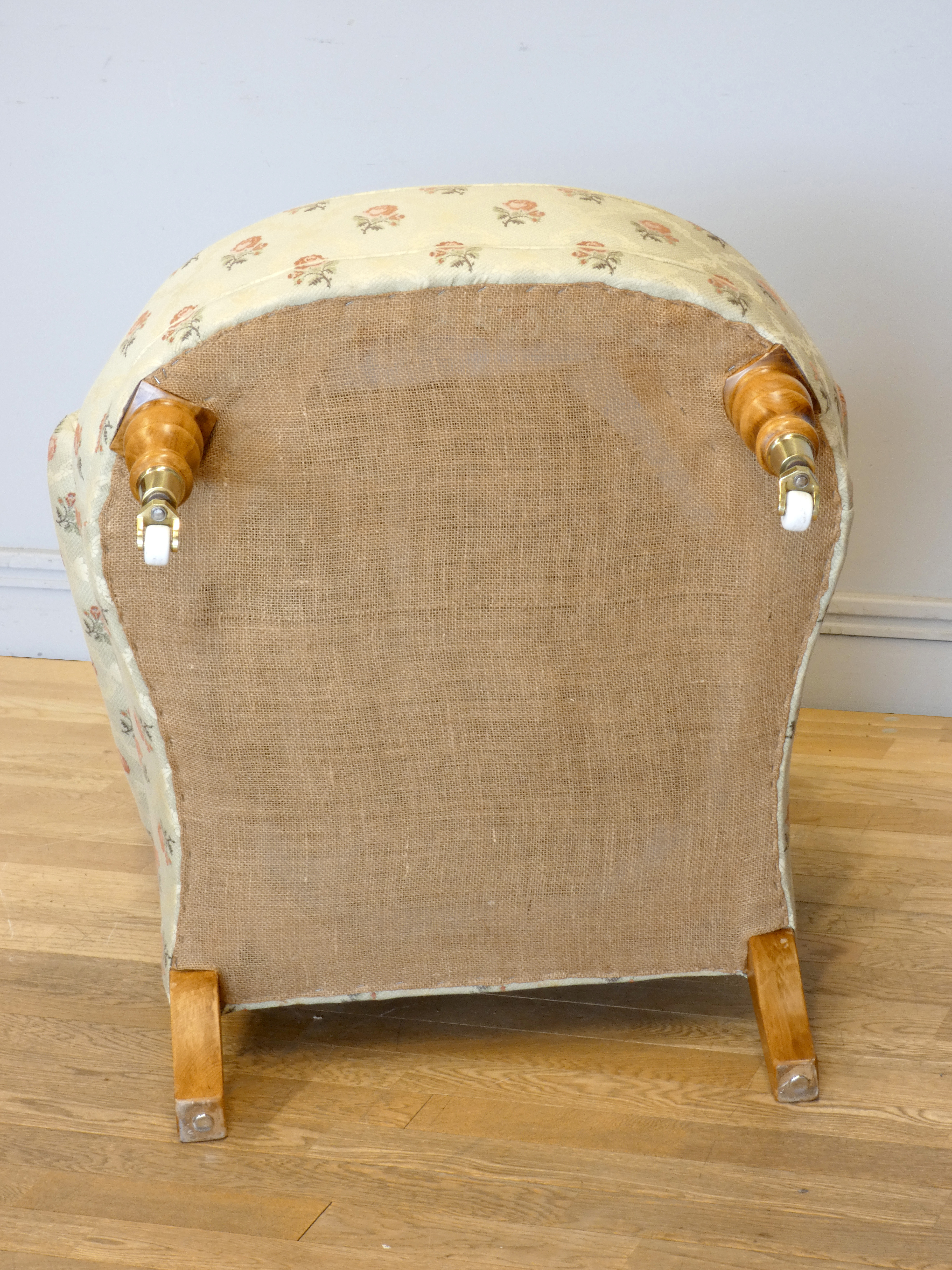 A Victorian style upholstered armchair, with button back and scroll arms, the front legs raised on - Image 5 of 5