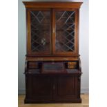 John Easten & Sons, Hull, a late Victorian mahogany bureau bookcase, the outswept pediment over a