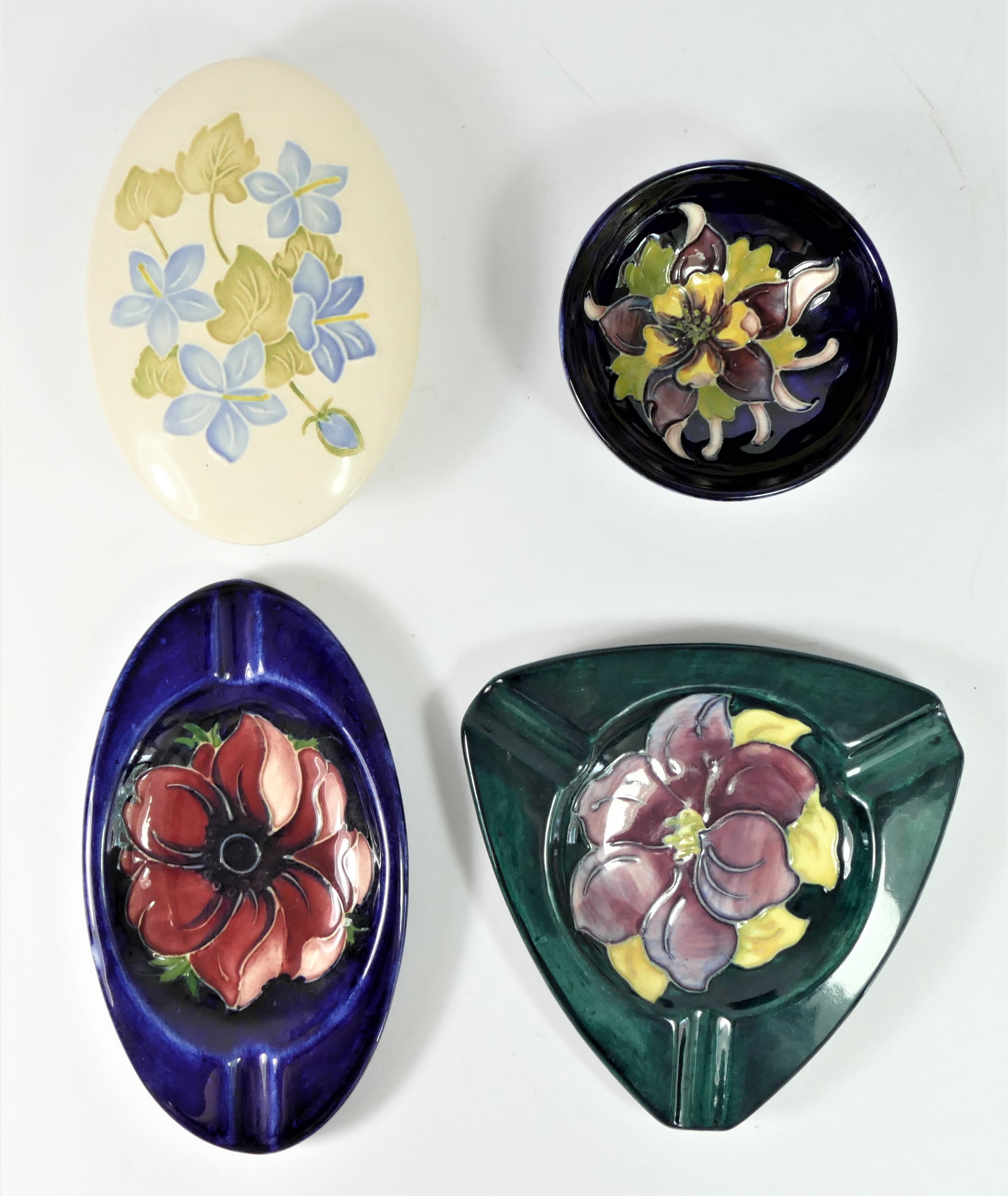 A Moorcroft Hibiscus pattern oval ash tray, impressed Moorcroft, Made in England, 16 x 9cm, a