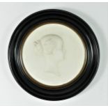 A 19th Century white bisque porcelain portrait plaque of Empress Eugenie, c. 1865, by J. Peyre for