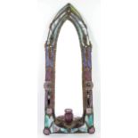 John Leathwood, Hull, an arched wall mirror with night light candle holder, with multi coloured