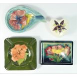 A Moorcroft Hibiscus pattern rectangular box cover, blue ground, impressed W. Moorcroft signature