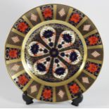 A Royal Crown Derby Imari 1128 pattern dinner plate gold banded, printed marks, 27cm.