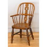 A Victorian ash and elm Windsor child's arm chair, with scroll splat and turned supports, 76cm.