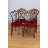 A Victorian set of four mahogany parlor chairs, carved scroll backs, upholstered seats and