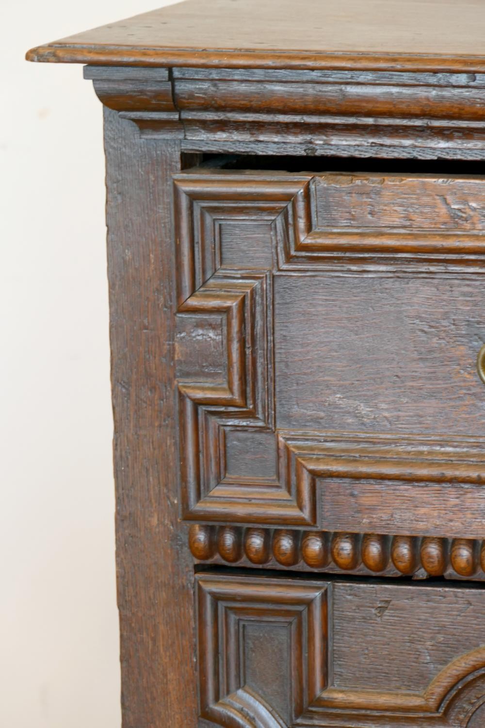 A late 17th century oak chest of three long drawers, two plank top over geometric moulded drawer - Image 3 of 5