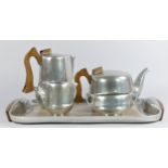 A Picquot Ware magnesium-aluminium alloy five piece tea service, mid 19th century, comprising tea