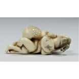 A Taish? period carved ivory netsuke of a copulating couple, signed, 5cm.