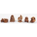 A Japanese wood netsuke of three frogs in a bucket, signed, 5.5cm, three other wooden netsuke of