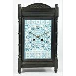 An Aesthetic Movement mantle clock, c.1880/90, the pottery tile dial mounted in an ebonised case,