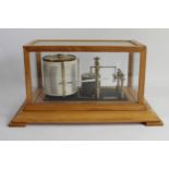 Negritti & Zambra, London, a mid 20th century light oak barograph, serial number R/45191, range 28.