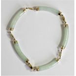 A Chinese 14ct gold mounted jadeite panel bracelet, by VVV, Birmingham import mark 1999, 19cm.