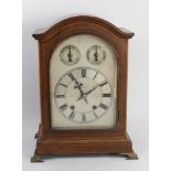 Russells Ltd., Liverpool, an early 20th century oak cased mantel clock, the silvered dial with