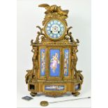 A late 19th century French gilt metal and porcelain panel mantle clock, retailed by Manoah Rhodes,