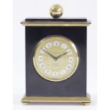 Gubelin, a gilt brass and black lacquer 8 day manual wind alarm clock, numbered 665387, 9.5 x 7cm.