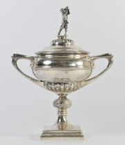 A silver golfing trophy, by Manoah Rhodes, Sheffield 1925, the pull off cover with a golfer in