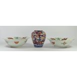 A Japanese Meiji period pair of Kakiemon bowls, with impressed body and floral decoration,