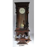 A 19th century walnut Vienna regulator type two weight wall clock, the 8 1/4" ivorine dial with