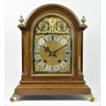 Winterhalder & Hofmeier, an Edwardian oak mantle clock, the gilt arched dial with silvered chapter