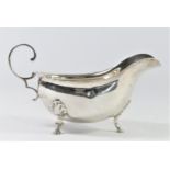 A silver sauce boat, Sheffield 1919, with wavy border, shell capped pad feet, 15.5cm, 113gm