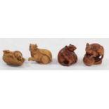A Japanese wood netsuke of two mice in a basket, signed, 4cm and three other wooden netsuke of mice,
