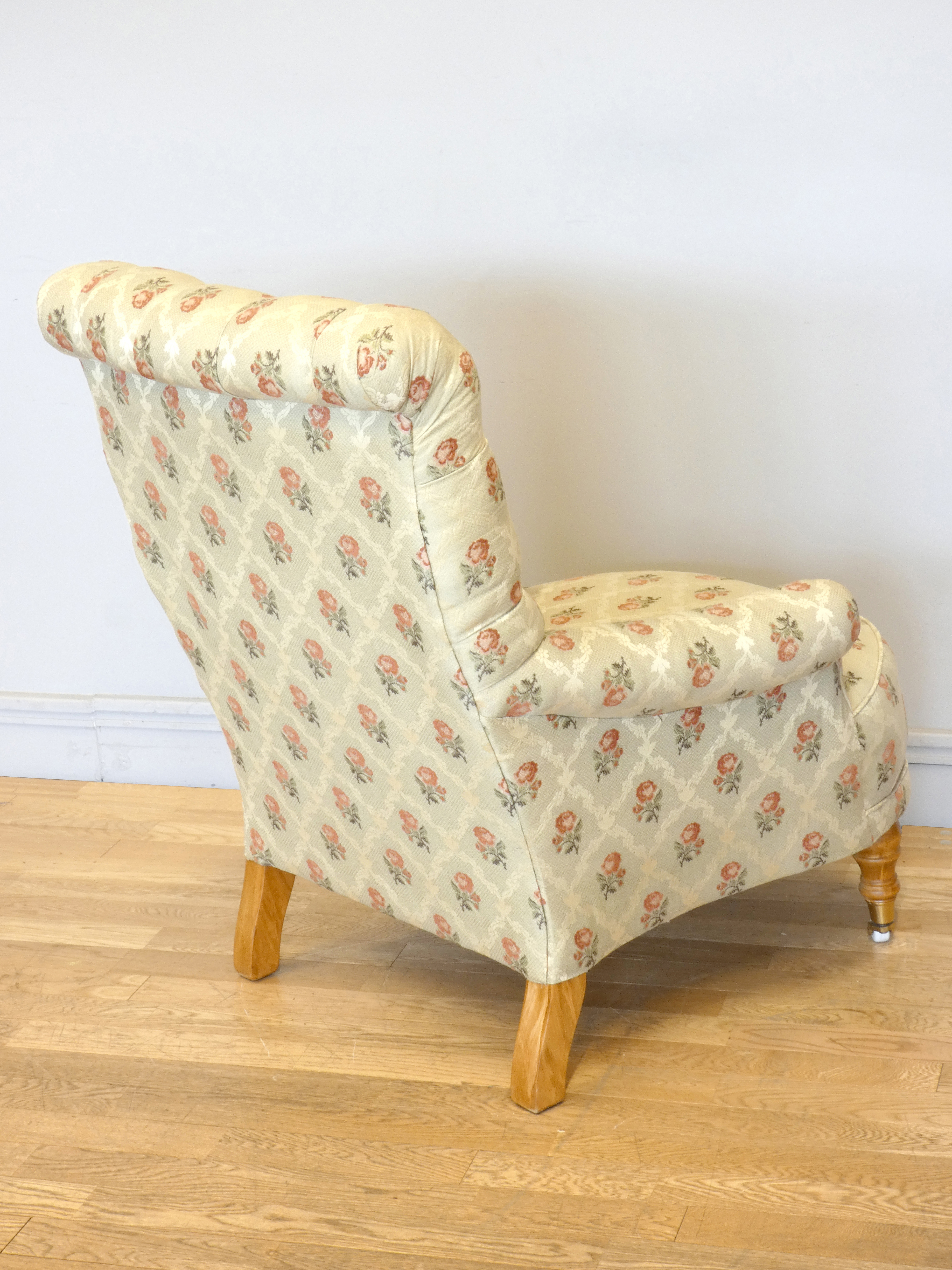 A Victorian style upholstered armchair, with button back and scroll arms, the front legs raised on - Image 4 of 5